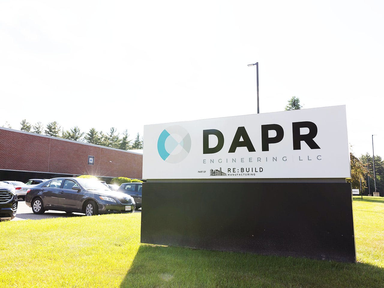 DAPR Sign in front of building