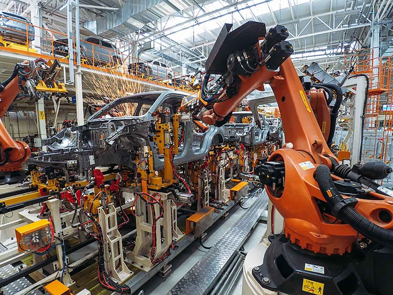Car going through an automated assembly line