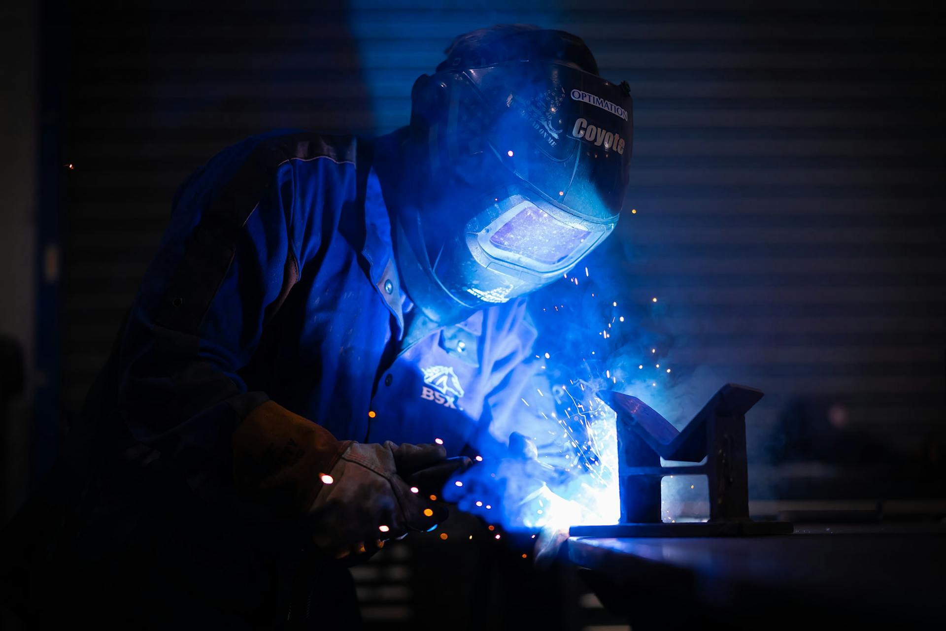 a person welding a material