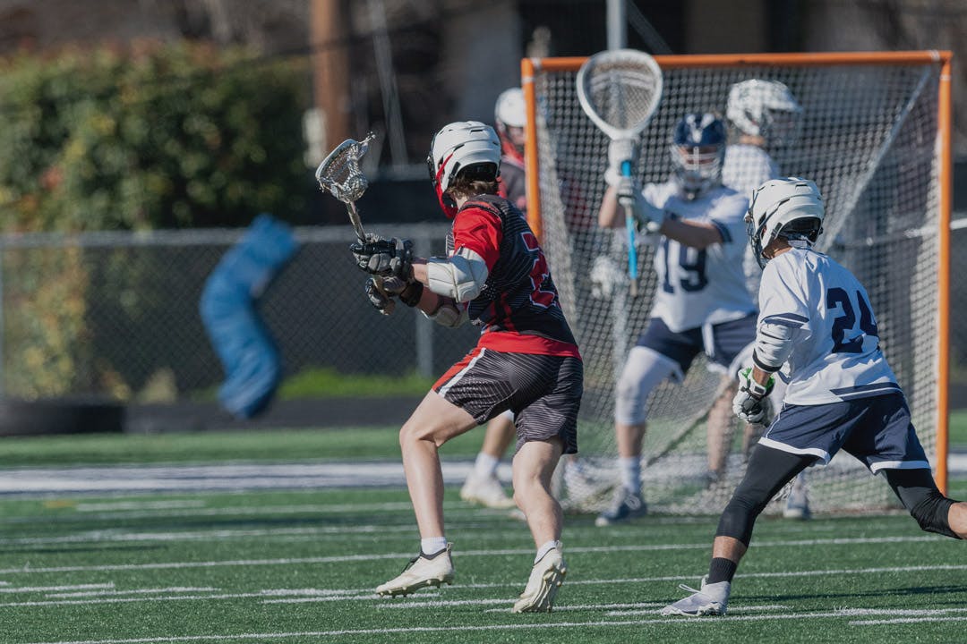 Lacrosse player going for a goal