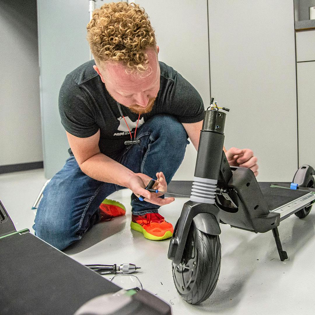 Industrial designer working on a prototype build of an electric scooter