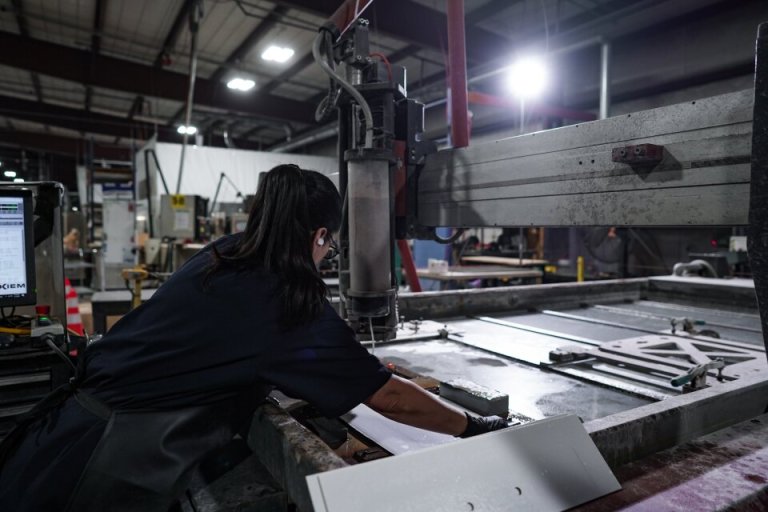 0-Blogs-CAMX PreShow-Center Employee working on machine